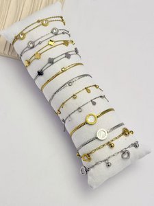 Lot 12 silver golden bracelets stainless steel on display