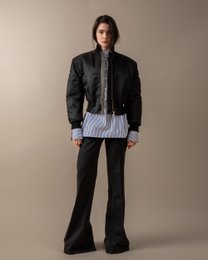 Black gathered detail bomber jacket with a high collar and ribbed cuffs and hem. Suitable for casual or formal wear.