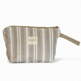 Large beige and white striped toiletry bag with zipper closure and wrist strap.