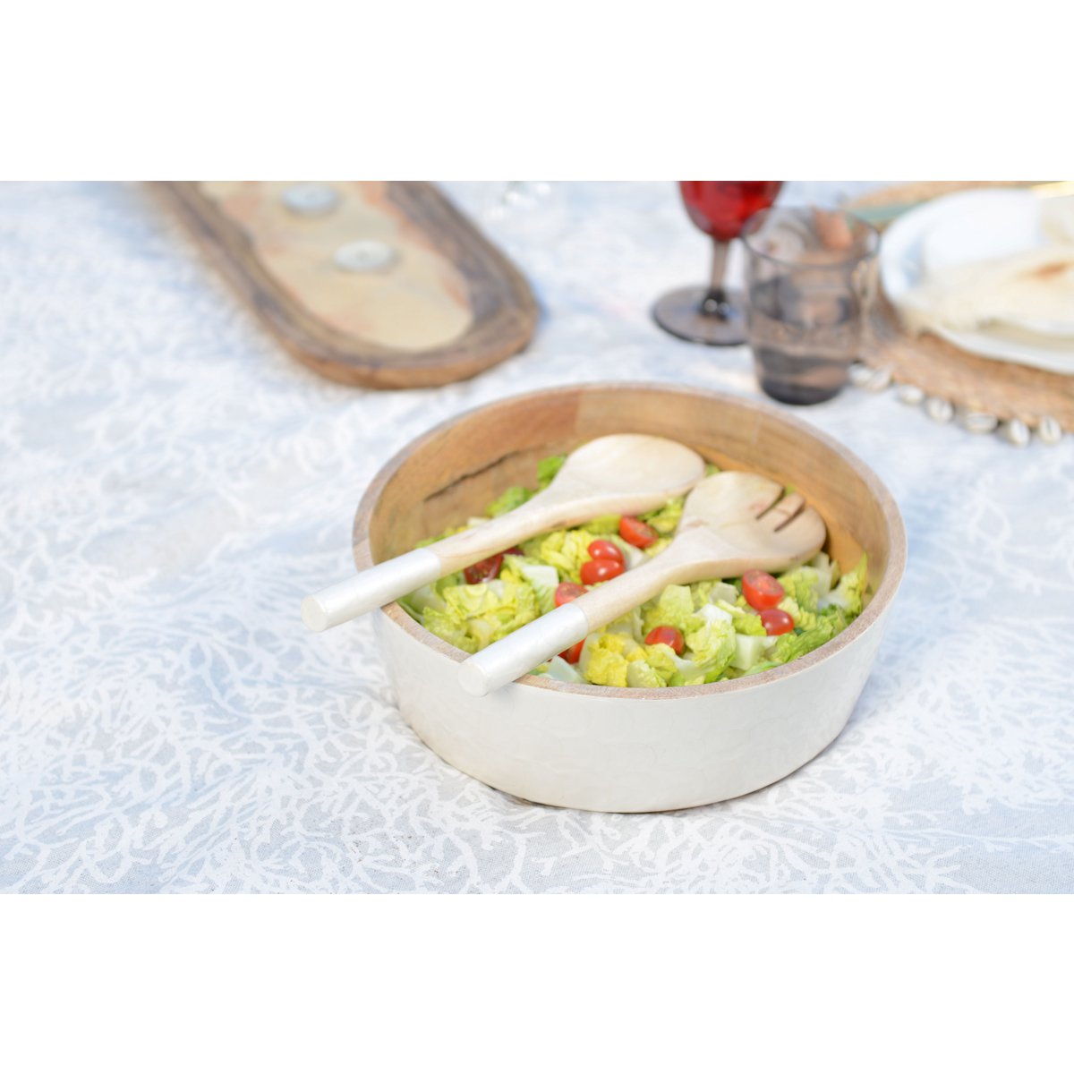 Saladier and white salad and mango salad cutlery