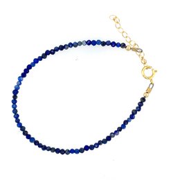 Delicate lapis lazuli bracelet with gold accents, perfect for September birthdays.
The image shows a beautiful bracelet made of lapis lazuli beads with gold-toned accents. The bracelet has a delicate, elegant design and would make a lovely gift, especially for someone born in September, as lapis lazuli is the birthstone for that month.