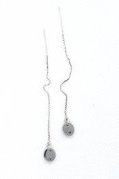 Silver drop earrings with copper star-shaped accents