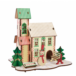 A wooden Christmas-themed building kit with a house, trees, and other decorative elements in green, red, and white colors.