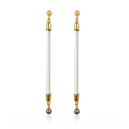 Elegant gold and crystal statement earrings with a long, slender design.