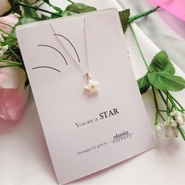 A delicate star-shaped pendant necklace on an 18-inch sterling silver chain. The necklace features a personalized message "You are a star" and makes a unique and thoughtful gift.

colors: The necklace features a silver-toned pendant with a star design.

materials: The necklace is made of sterling silver.

style: The necklace has a simple, minimalist design with a star-shaped pendant.

shape: The pendant is star-shaped.