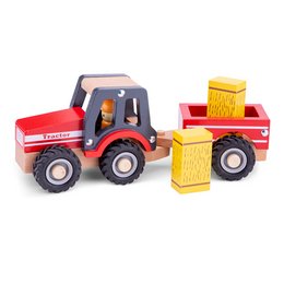 A red toy tractor with a trailer carrying yellow hay bales. The tractor has large wheels and a simple, blocky design typical of children's wooden toys.
