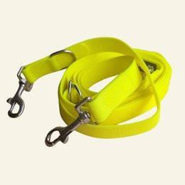 Bright neon yellow waterproof dog leash with metal clips, adjustable multiposition design for training and walking.