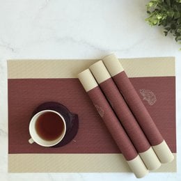 Woven PVC placemats, burgundy and beige striped, anti-skid, set of four, textured weave pattern.