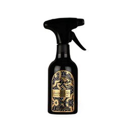 Black spray bottle with gold ornate Islamic calligraphy design, luxurious room fragrance