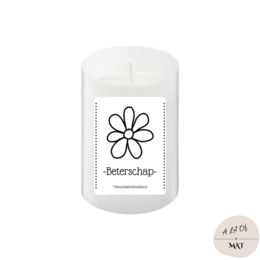 A white, round tealight candle with a simple daisy-like flower design printed on the label. The label reads "Wenskaarsje | Beterschap", indicating this is a get-well wish candle.