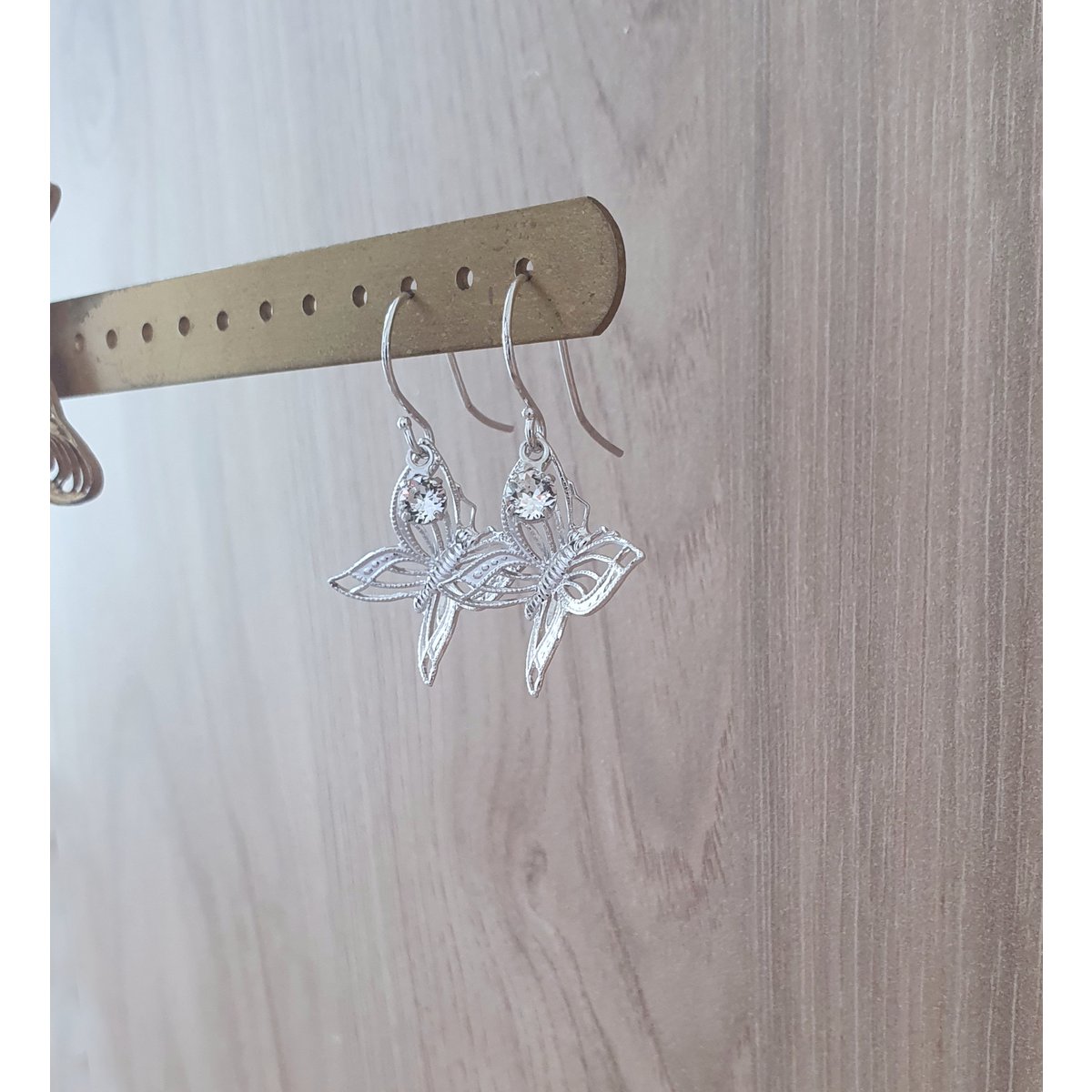 Rhodium plated butterfly earrings with charms