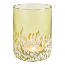 A green glass lantern with a cylindrical shape, measuring 10x14x10cm. It is designed to hold tea light candles and features a decorative pattern of yellow and white dots.