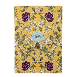 A yellow notebook with a floral pattern featuring purple flowers and green leaves on the cover.