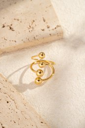Bague acier inoxydable ajustable moderne boules rondes alignées dorée
