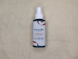 Facial oil in a clear glass bottle with a spray nozzle. The product is labeled "Promar Facial Oil" and includes information about its natural ingredients and benefits.