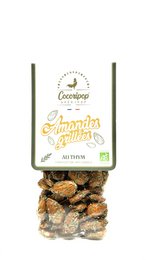  Roasted almonds with thyme, organic dried nuts, brown tan color, natural healthy snack, aromatic herbs