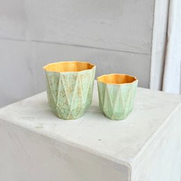 Stoneware medium poly cup in spring glow colors with a textured, geometric pattern.