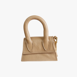 Beige poop bag holder with a compartment for dog treats and a poop bag dispenser. Made of durable material with a stylish design.