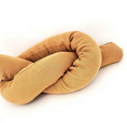 Decorative caramel-colored pillow in the shape of a snake, designed for children's rooms. Features a soft, plush texture and a unique, playful design.