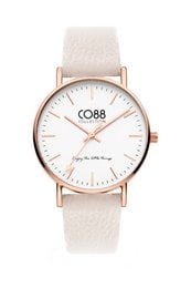 A 36mm watch with a coconut milk-colored leather strap and a rose gold-colored case. The watch face features a simple, minimalist design with the CO88 logo.