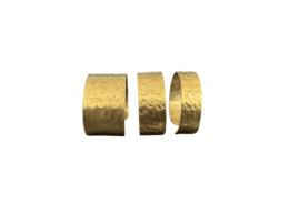 Golden brass bracelets, textured ethnic design, wide cuff style, pack of three, metallic gold finish.