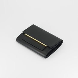 Black leather wallet with 22k gold accent, compact and minimalist design, suitable for everyday use.