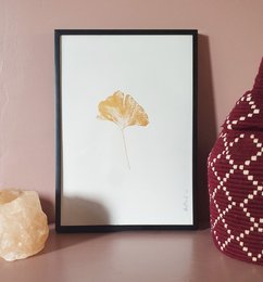 Ginkgo leaf print in golden color, minimalist botanical wall art, suitable for home decor.