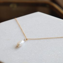 Elegant gold-filled or sterling silver pendant necklace with a single pearl accent, perfect for everyday wear.