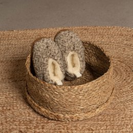 Kids' Merino Bootie Slippers in brown, featuring a soft, plush interior and a cozy, textured exterior. Suitable for ages 4-7 years.