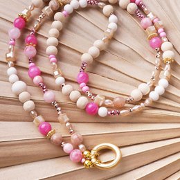 Pink and white beaded necklace with gold accents, interchangeable charm pendant, gemstone beads.