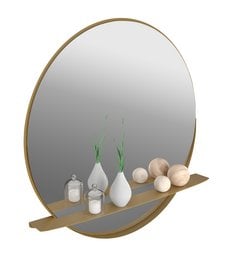 Oval gold-framed wall mirror with a wooden shelf for decorative items.