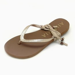 Gold flip flops with a simple, minimalist design. Made of durable materials for comfortable wear.