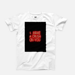 A white t-shirt with a bold, red text graphic that says "I HAVE A CRUSH ON YOU" against a black background.