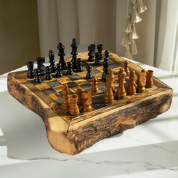 Rustic olive wood chess set with natural live edge, handmade wooden board, black and natural pieces, drawer storage.