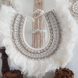 Decorative necklace with feathers and shells