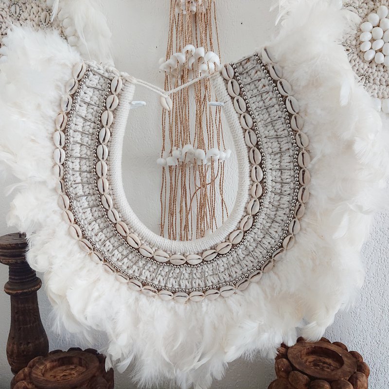 Decorative necklace with feathers and shells