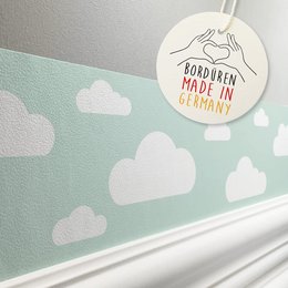 Mint and green cloud-patterned wallpaper border for a kids' room, featuring a whimsical cloud design.