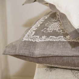 Gray linen pillowcase with delicate lace trim. Soft, natural fabric in a classic Chateau style. Suitable for use as a decorative cushion or bedroom accent.