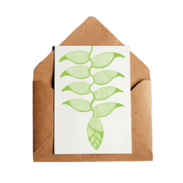 A6 postcard with an illustration of green leaves on a white background, enclosed in a brown envelope.