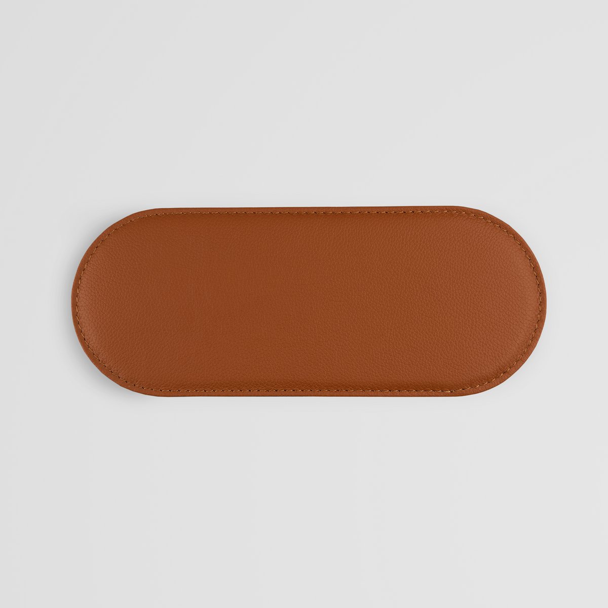 Coussin élégant en cuir marron pour petits accessoires