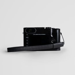 Minimalistische zwarte lederen camerapolsband voor kleine en middelgrote digitale camera's