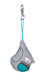 A gray and teal monster-shaped keychain with large eyes and a toothy grin. The keychain has a blue strap for attaching to bags or clothing.