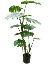 Tall artificial monstera plant with large green leaves in a pot.