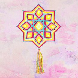Colorful, star-shaped wall decor with intricate patterns and tassels. The product appears to be a decorative wall hanging or ornament.
