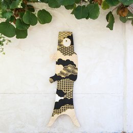 Black and gold patterned koinobori (carp streamer) for kids, featuring a decorative fish shape and hanging design.