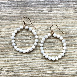 White and turquoise beaded hoop earrings with gold-plated hardware.