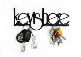 Black metal key hanger with the word "keyhee" displayed. Includes multiple keys hanging from the hanger.