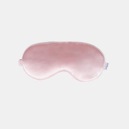 Pink silk sleep mask, soft rounded eye cover, adjustable elastic straps, luxurious bedtime accessory
