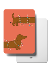  Festive Christmas card featuring two dachshund dogs with string lights. The card has a warm orange background and the dogs are depicted in a playful, holiday-themed design.