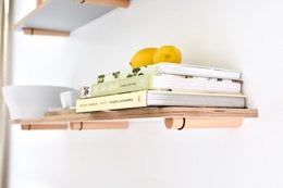 White 50cm wall shelf with wooden accents, suitable for displaying decorative items.